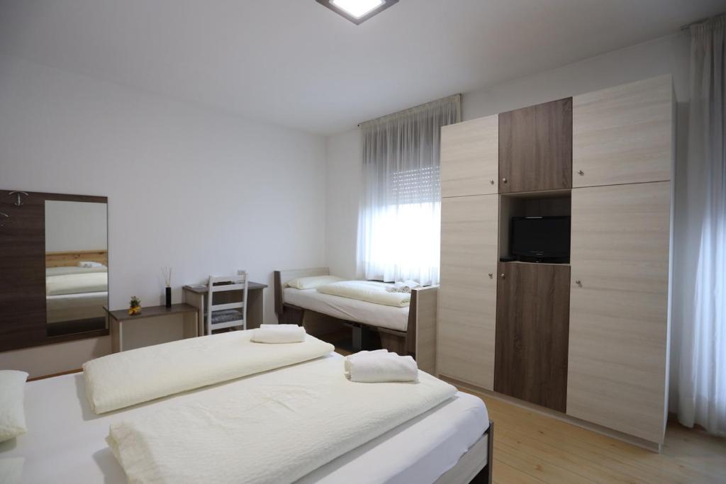 Posteľ alebo postele v izbe v ubytovaní Albergo Bellaria