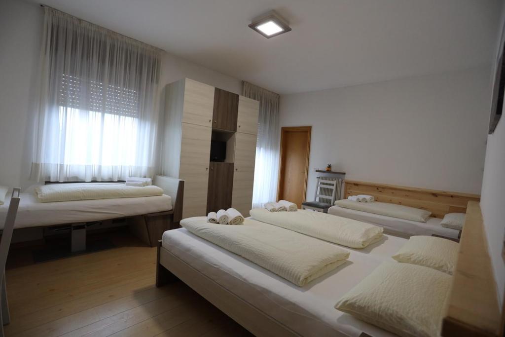 Posteľ alebo postele v izbe v ubytovaní Albergo Bellaria