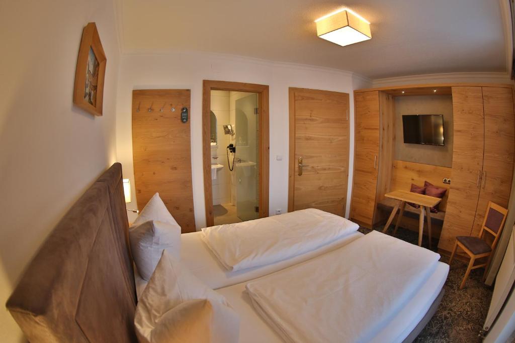 Postel nebo postele na pokoji v ubytování Aparthotel Acksteiner
