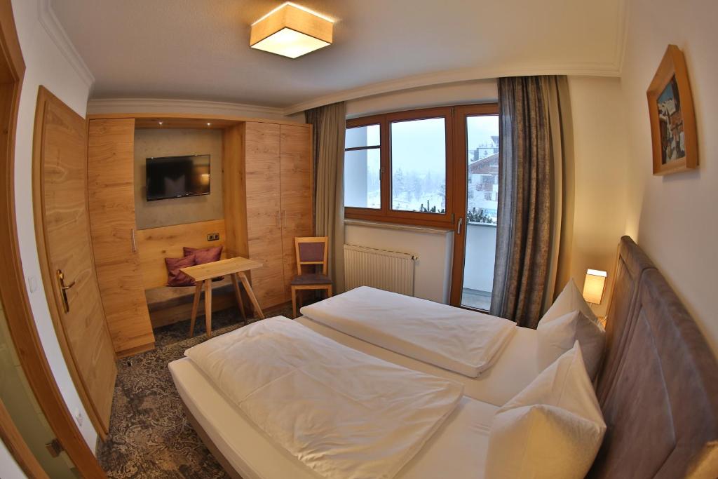 Postel nebo postele na pokoji v ubytování Aparthotel Acksteiner
