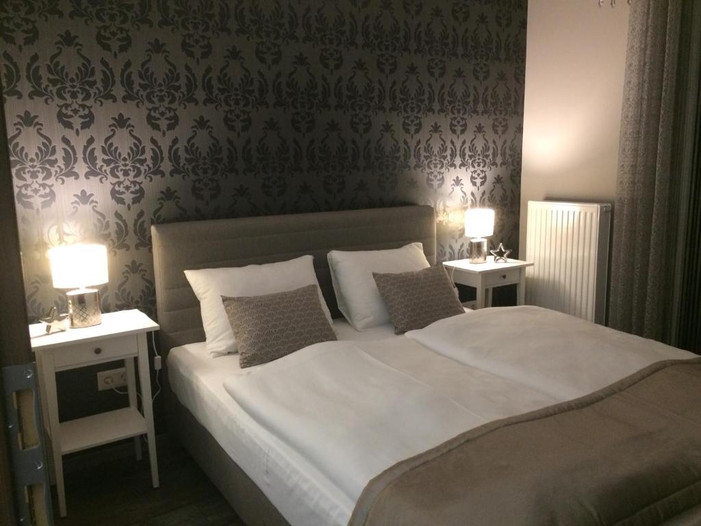 Postel nebo postele na pokoji v ubytování Orient Suite