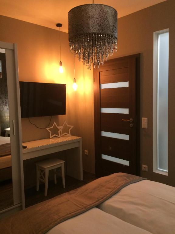 Postel nebo postele na pokoji v ubytování Orient Suite