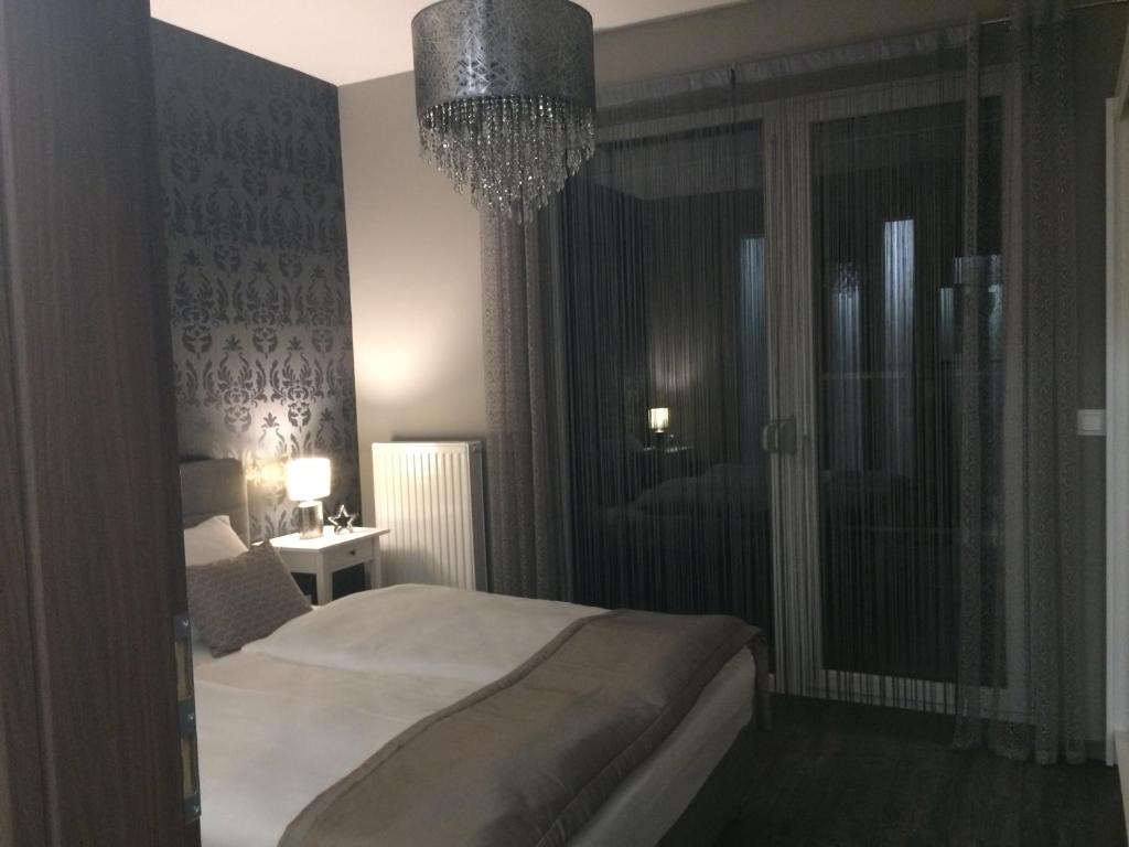 Postel nebo postele na pokoji v ubytování Orient Suite