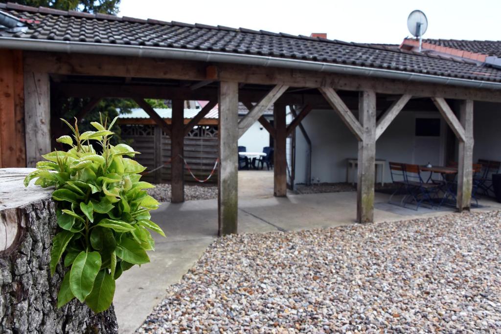 a wooden pavilion with a table and a table at Kutscherhof Broock in Broock