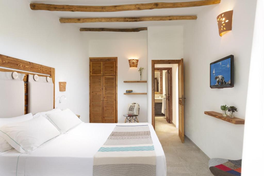 Postel nebo postele na pokoji v ubytování Park Hotel & Spa Cala Di Lepre