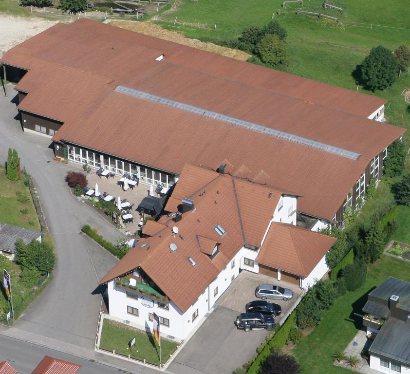 an overhead view of a large house with brown roofs at Landhotel Wiesenhof in Heroldstatt