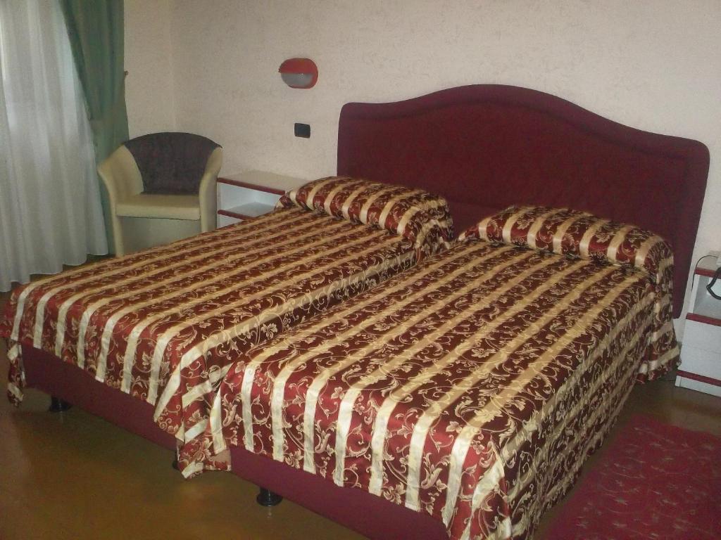 Postel nebo postele na pokoji v ubytování Hotel Gaggiano