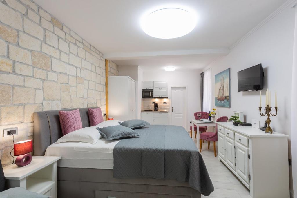 Posteľ alebo postele v izbe v ubytovaní Apartman Arbol