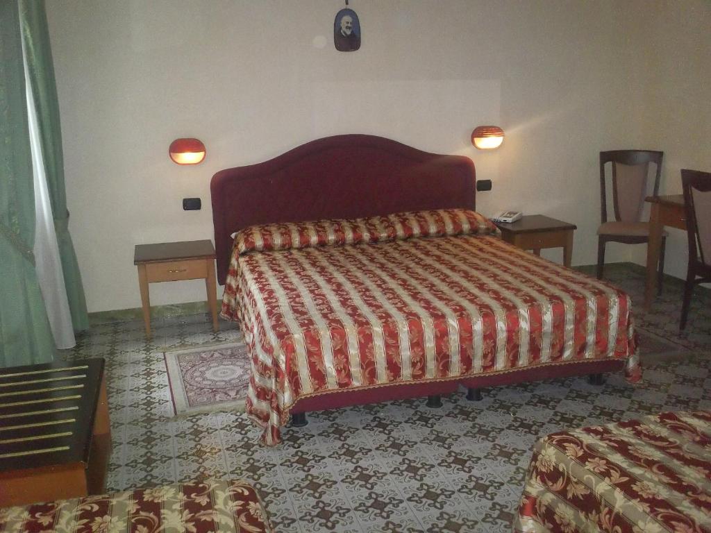 Postel nebo postele na pokoji v ubytování Hotel Gaggiano