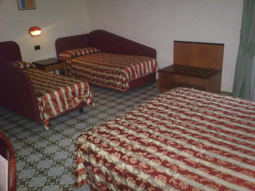 Postel nebo postele na pokoji v ubytování Hotel Gaggiano