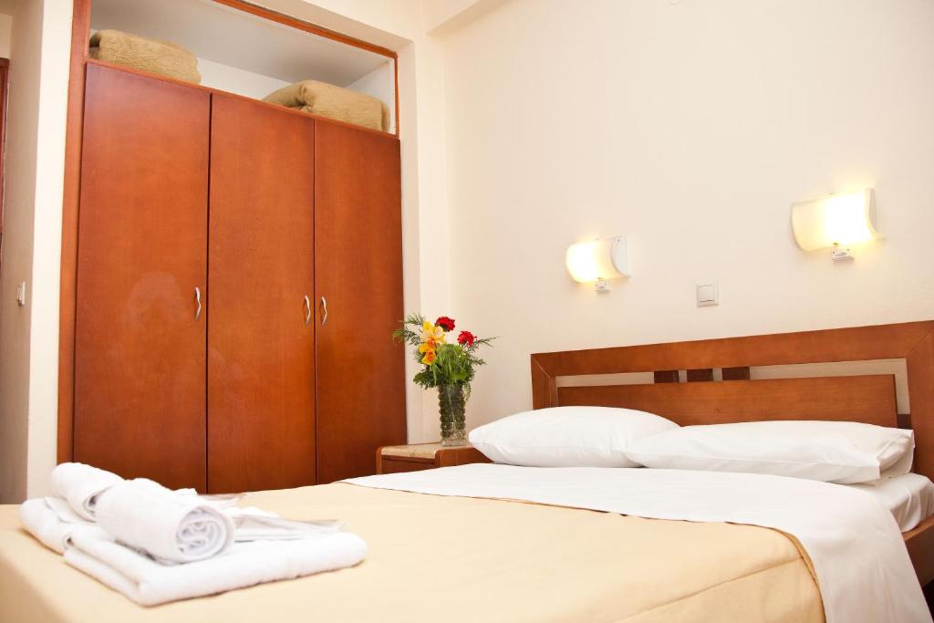 Postel nebo postele na pokoji v ubytování Akroyali Hotel & Villas