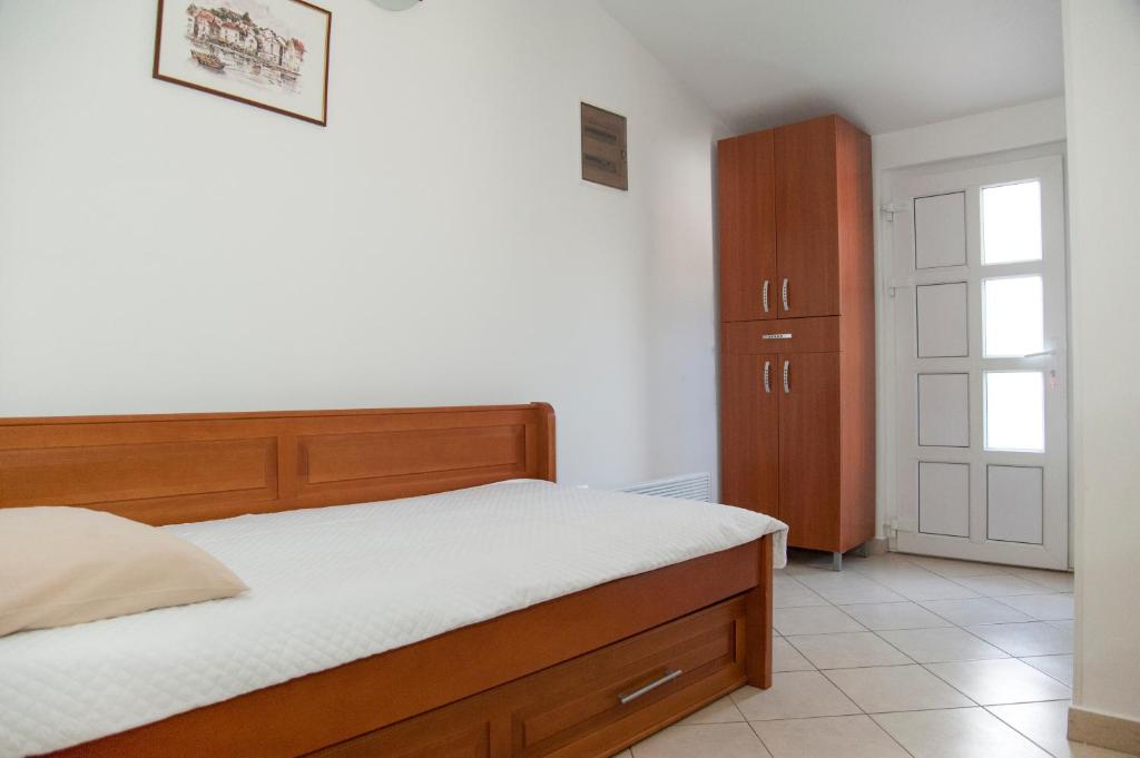 Postel nebo postele na pokoji v ubytování Apartments Mako