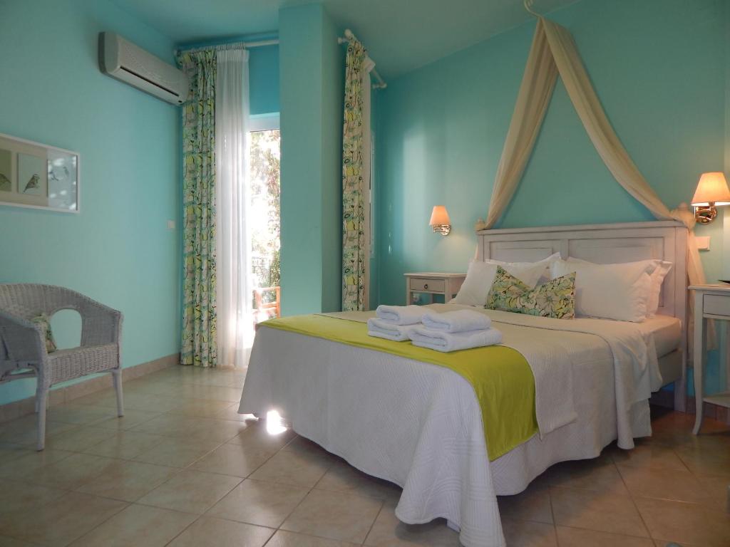 Postel nebo postele na pokoji v ubytování Palmina Mare Villa and Studios