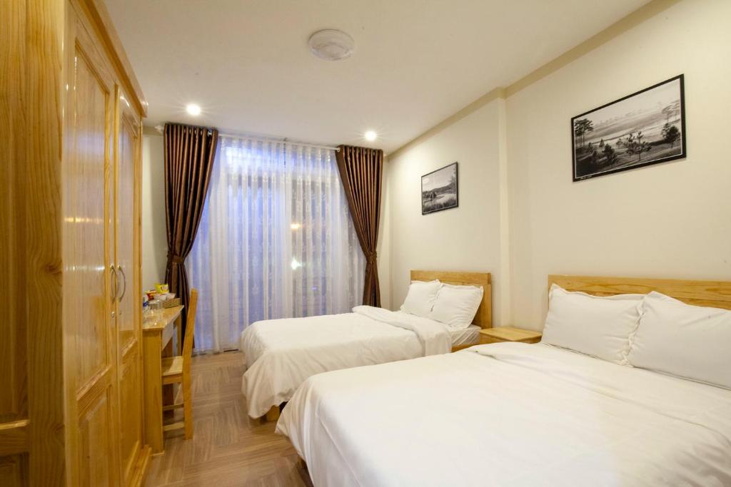 Postel nebo postele na pokoji v ubytování THIEN AN GUEST HOUSE
