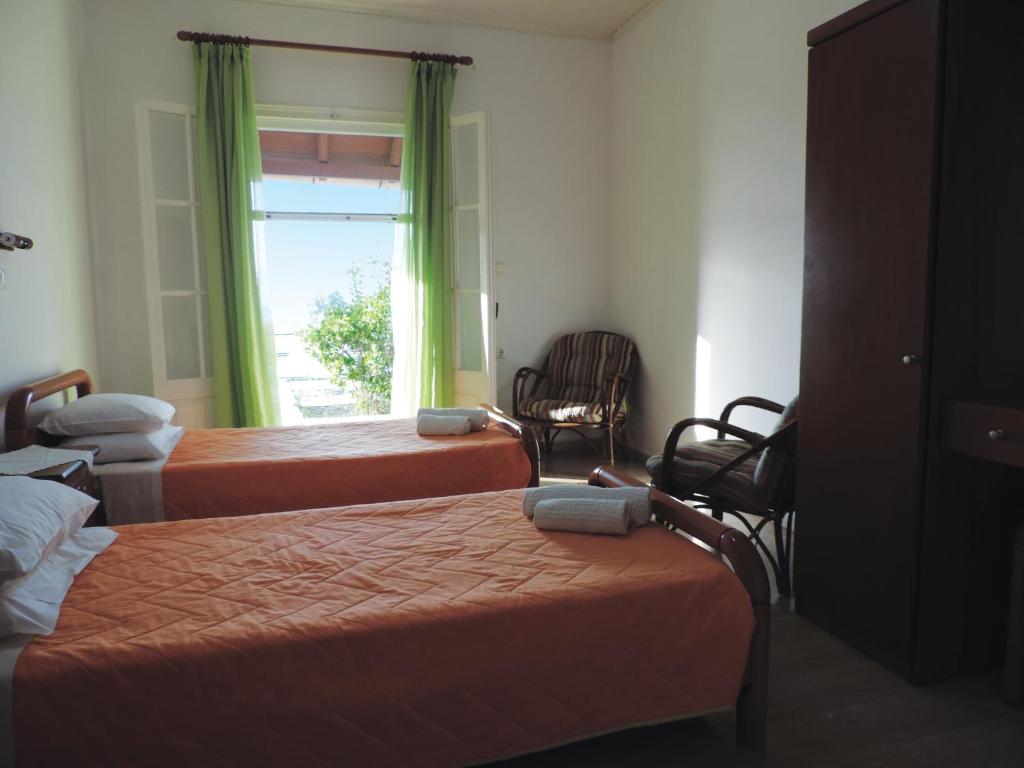 Postel nebo postele na pokoji v ubytování APARTMENTS PELI-MARIA