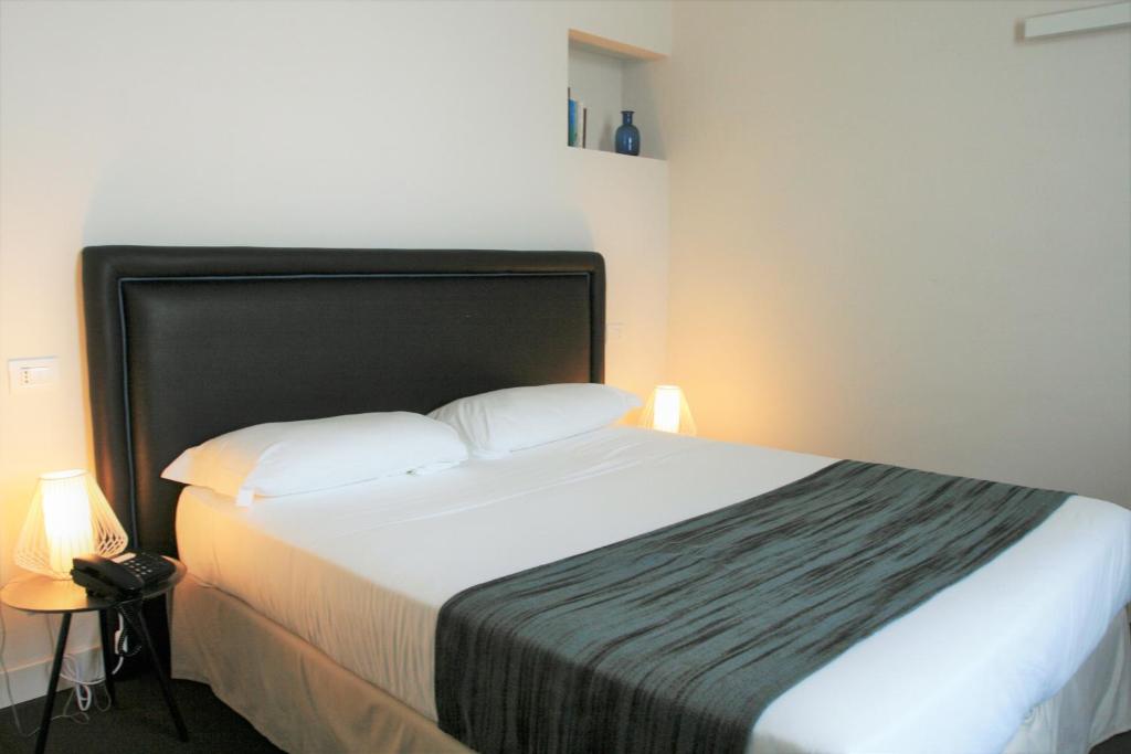 A bed or beds in a room at Hotel Palazzo Vannoni