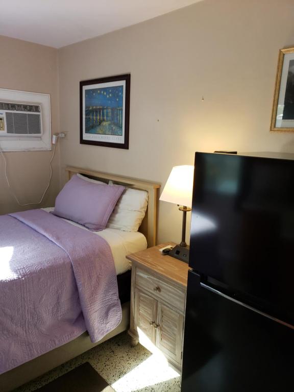 Postel nebo postele na pokoji v ubytování Siesta Motel