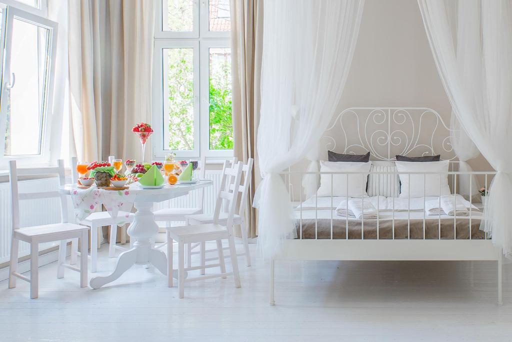 Posteľ alebo postele v izbe v ubytovaní Riviera Residence Apartments