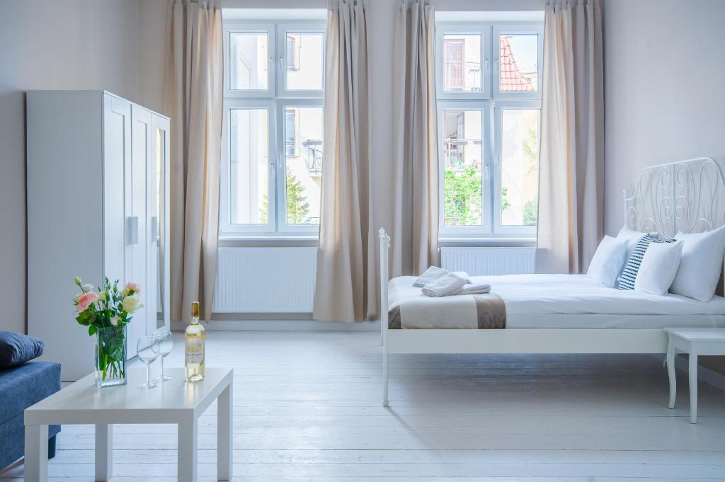Posteľ alebo postele v izbe v ubytovaní Riviera Residence Apartments