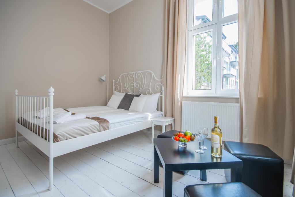 Posteľ alebo postele v izbe v ubytovaní Riviera Residence Apartments