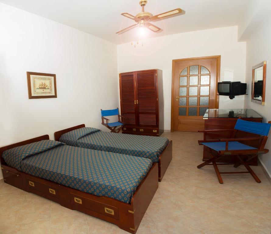 Postel nebo postele na pokoji v ubytování Elihotel