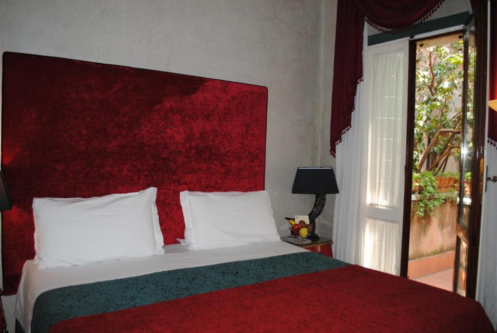 Postel nebo postele na pokoji v ubytování Palazzo del Giglio