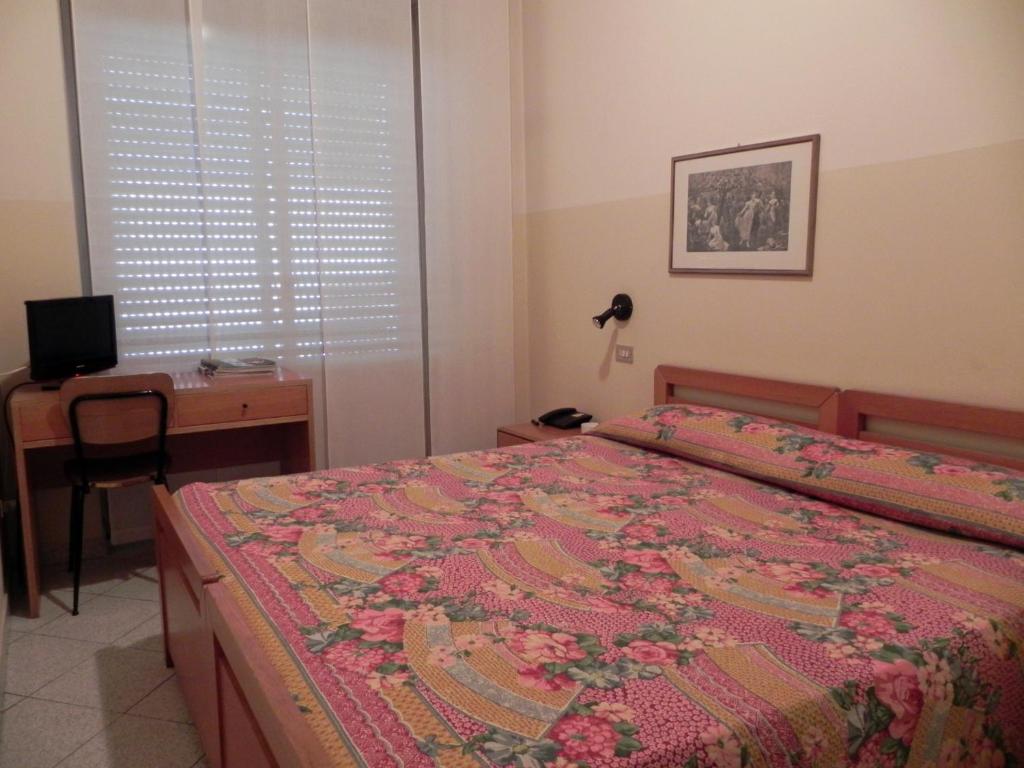 Postel nebo postele na pokoji v ubytování Albergo Sant'Anna