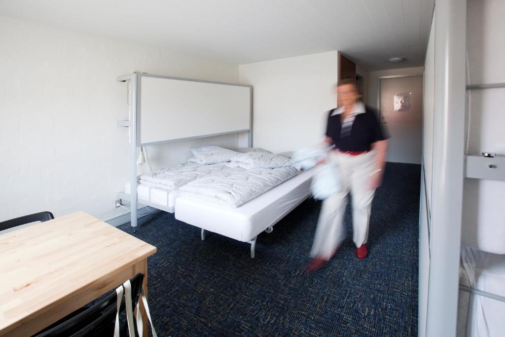Postel nebo postele na pokoji v ubytování Danhostel Frederikshavn City