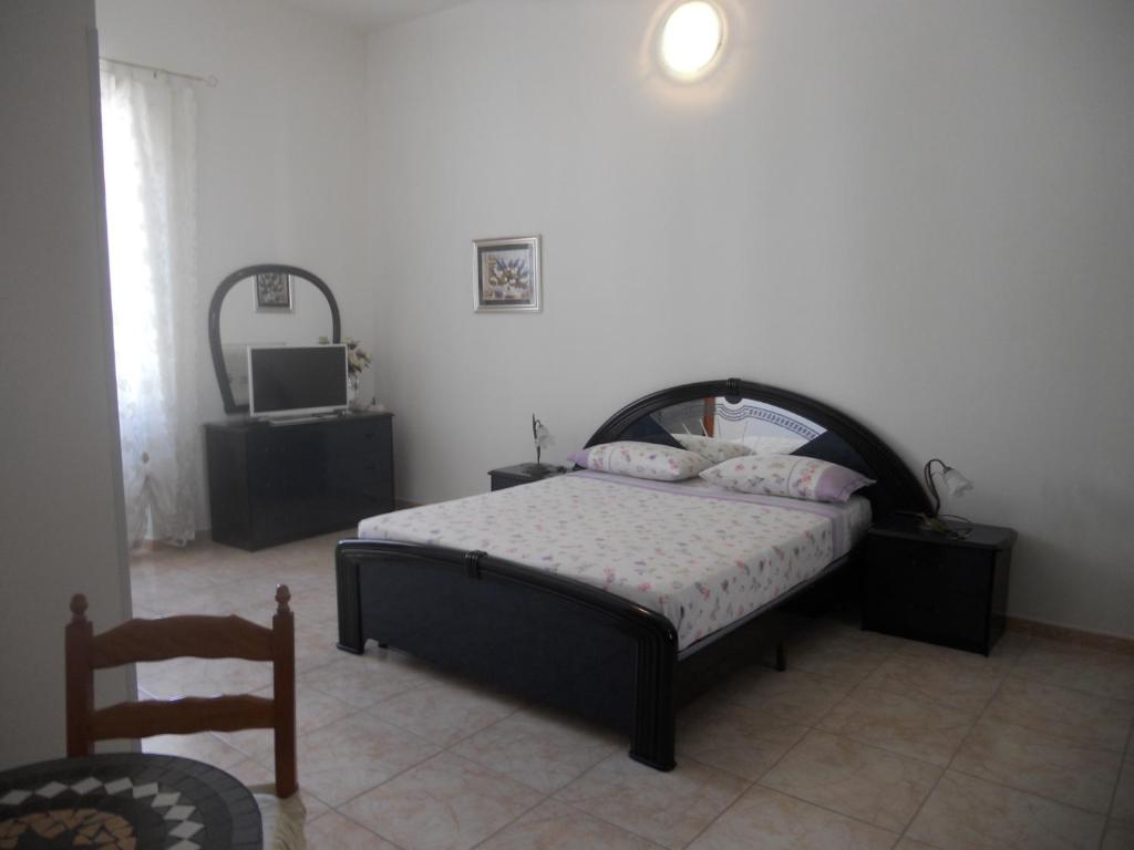 Postel nebo postele na pokoji v ubytování Guest House Efisio