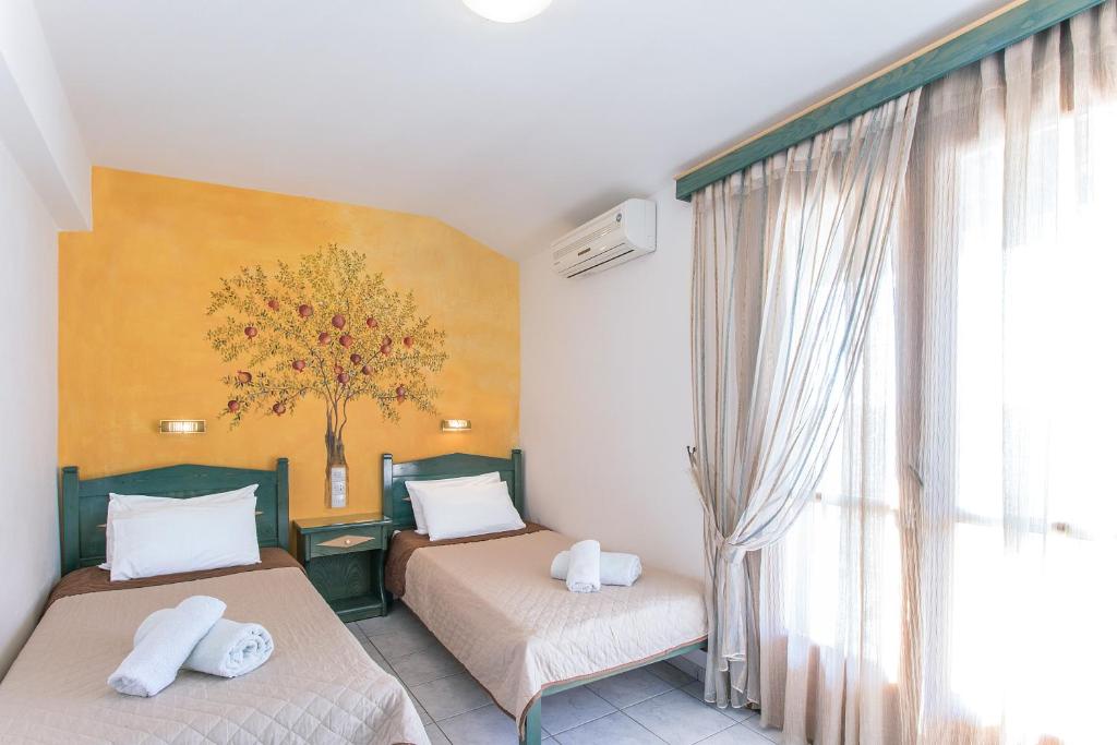 Postel nebo postele na pokoji v ubytování Stefanis House