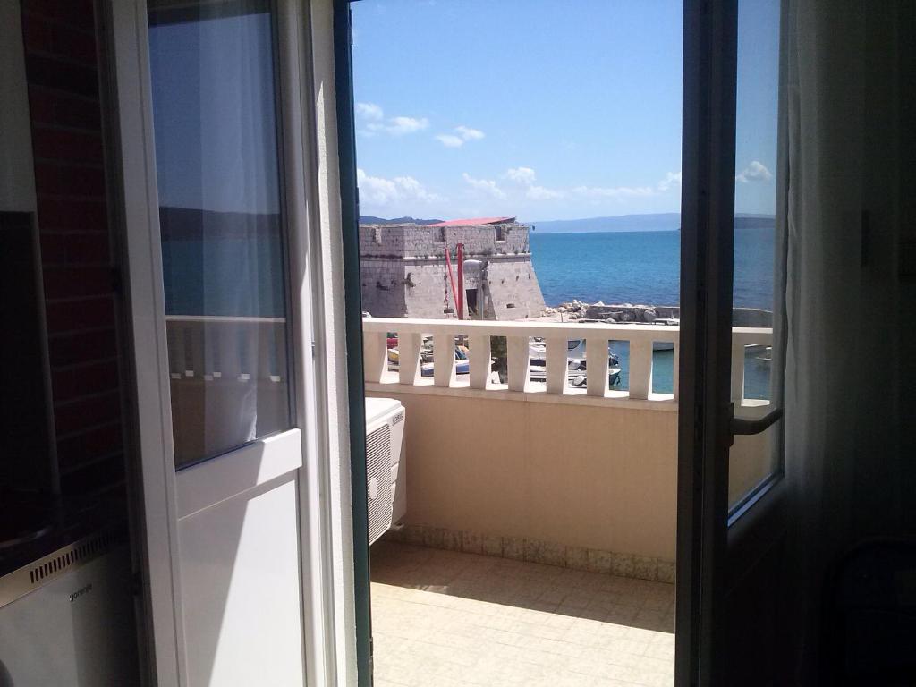 a view of the ocean from the balcony of a condo at Studio Apartment Mala plaža in Kaštela