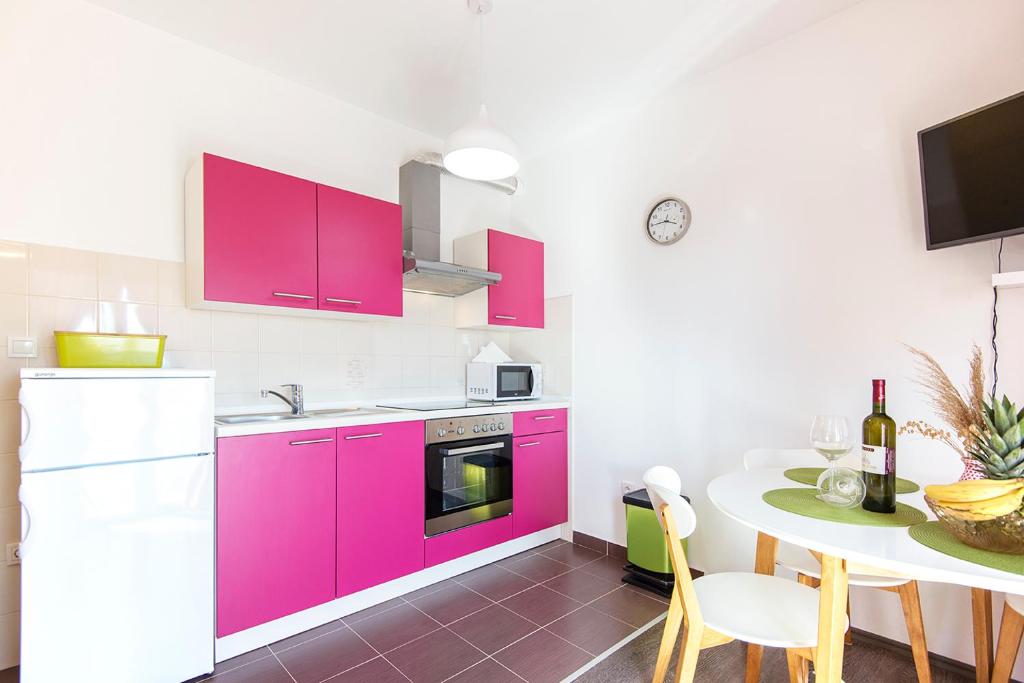 Kuchyň nebo kuchyňský kout v ubytování Apartments CAPE Deluxe