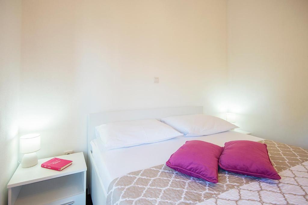 Postel nebo postele na pokoji v ubytování Apartments CAPE Deluxe
