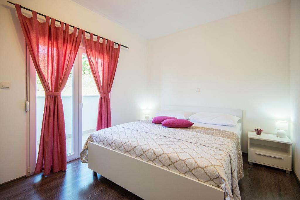 Postel nebo postele na pokoji v ubytování Apartments CAPE Deluxe