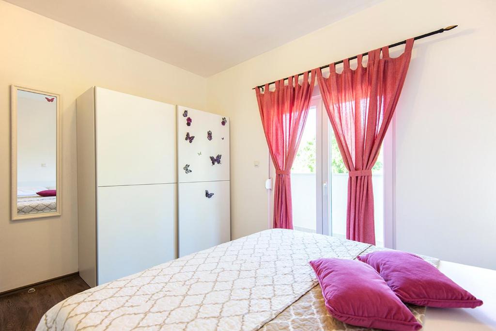 Postel nebo postele na pokoji v ubytování Apartments CAPE Deluxe