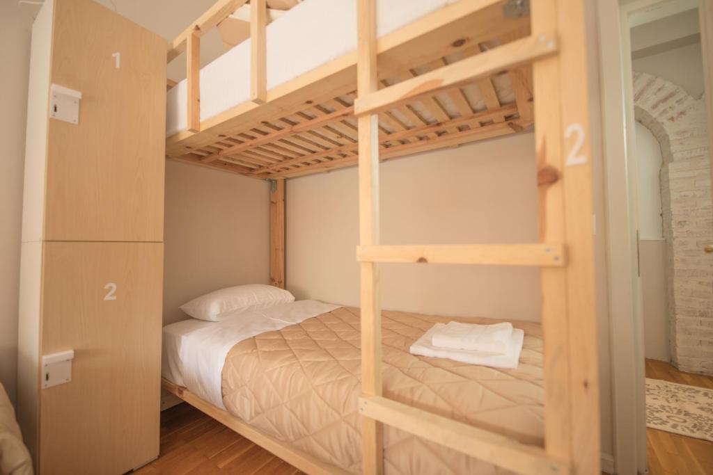 Letto o letti in una camera di Mosaic Home