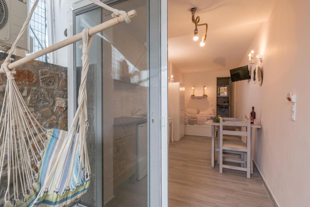 a room with a view of a kitchen and a living room at Olympus Studios in Malia
