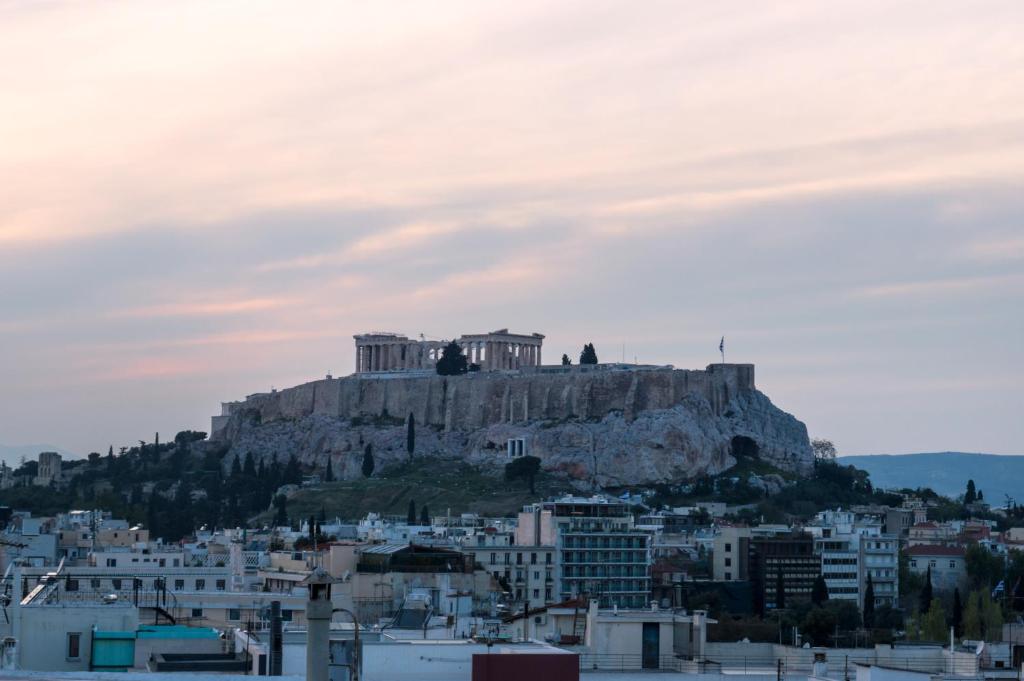 a view of the acropolis of athens from the city at Acropolis View Rooftop Apartment Athens in Athens