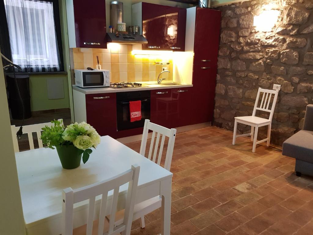 Kuchyň nebo kuchyňský kout v ubytování Casa Sermichelino