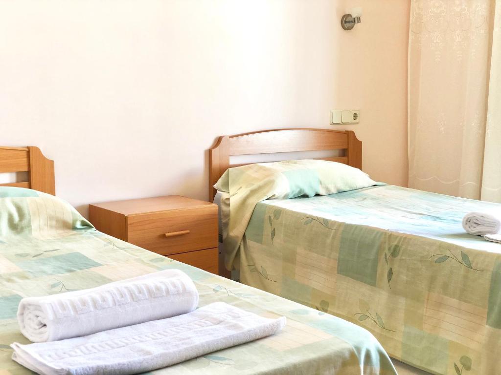 Кровать или кровати в номере Apartamentos Benet