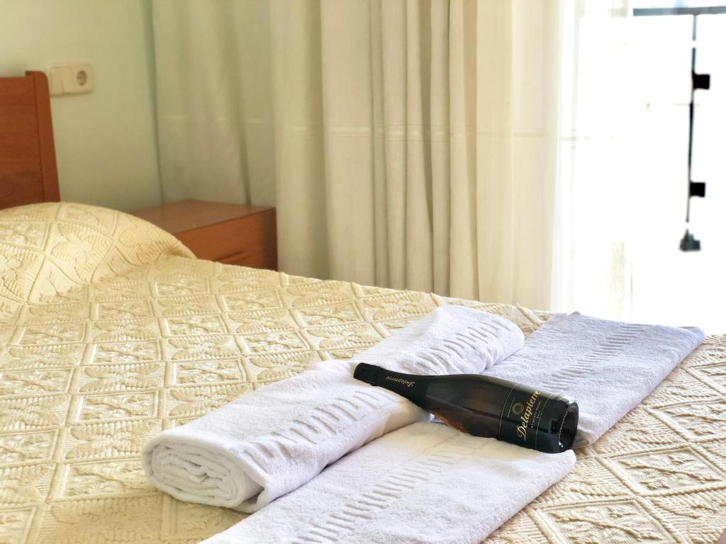Кровать или кровати в номере Apartamentos Benet
