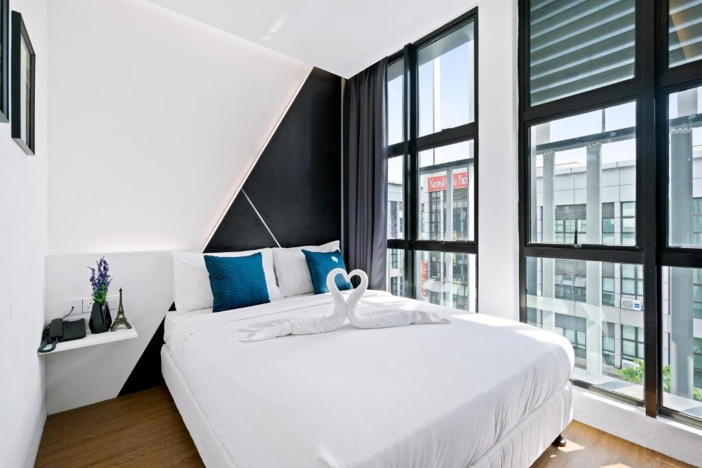 Postel nebo postele na pokoji v ubytování Rica Hotel Usj