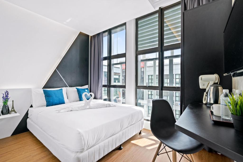 Postel nebo postele na pokoji v ubytování Rica Hotel Usj