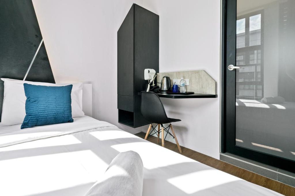 Postel nebo postele na pokoji v ubytování Rica Hotel Usj