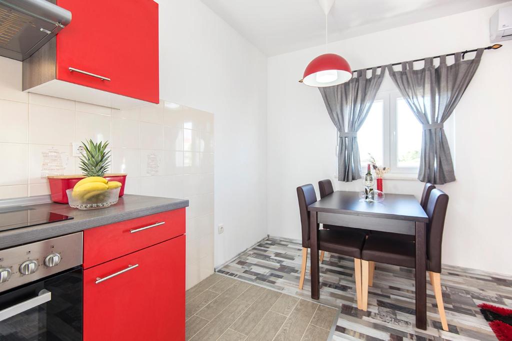 Kuchyň nebo kuchyňský kout v ubytování Apartments CAPE Deluxe