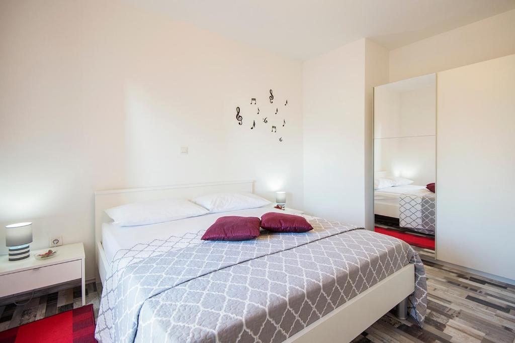 Postel nebo postele na pokoji v ubytování Apartments CAPE Deluxe