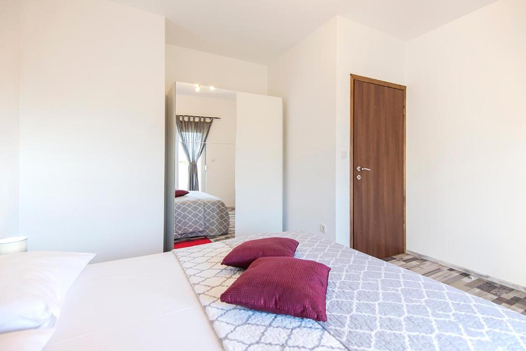 Postel nebo postele na pokoji v ubytování Apartments CAPE Deluxe