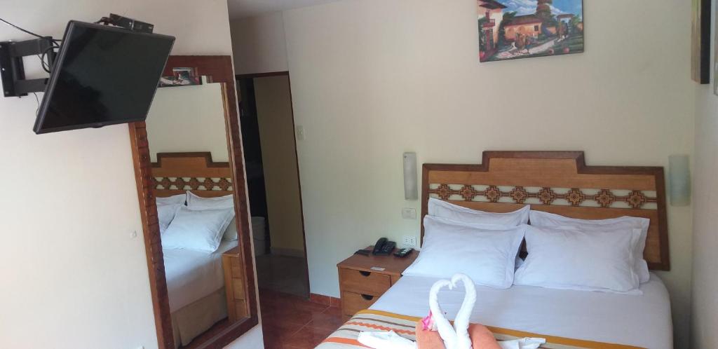 Cama o camas de una habitación en Hostal Vista Waynapata 123