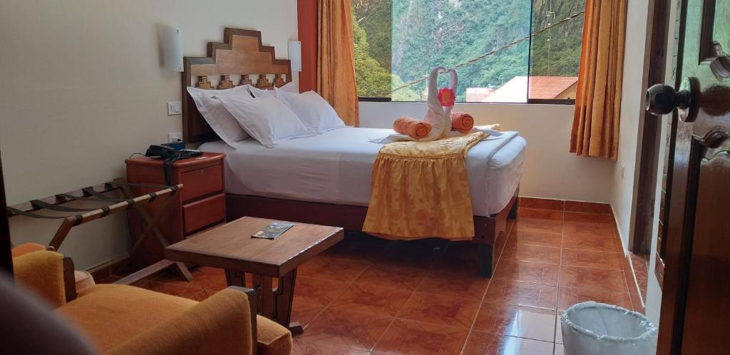 Cama o camas de una habitación en Hostal Vista Waynapata 123