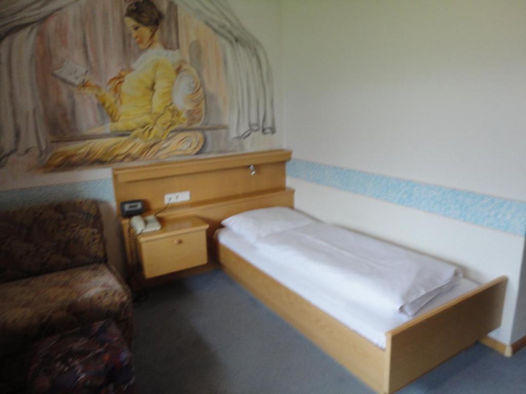 Voodi või voodid majutusasutuse Hotel Saxl toas